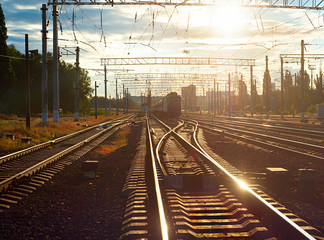 Train on railroad at sunset