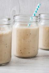 Banana smoothie on white table
