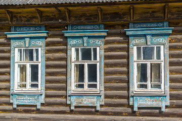 Fototapeta na wymiar Carved window in old russian wooden country house
