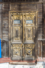 Carved wooden door of  old house, Russia