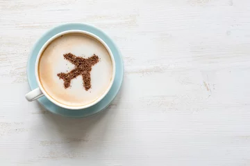 Zelfklevend Fotobehang Airplane made of cinnamon in coffee. Cup of Cuppuccino. Travel concept © zinaidasopina112