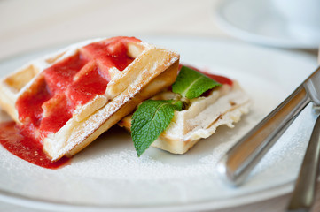 Belgian waffles with strawberry sauce