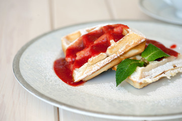Belgian waffles with strawberry sauce