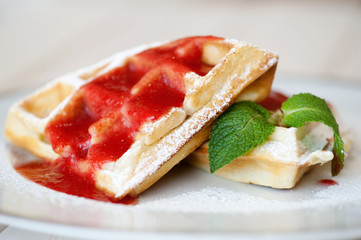 Belgian waffles with strawberry sauce
