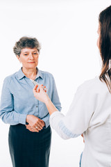 Fototapeta premium Nurse showing to patient a thermometer