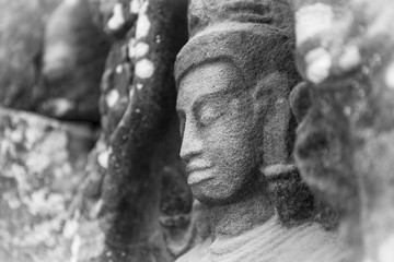 Close up portrait of Shiva low relief, Cambodia. Black and white