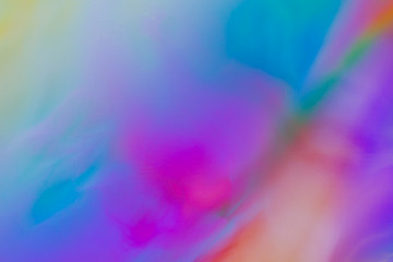 Colorful psychedelic blur showing stress distribution in plastic using polarized light