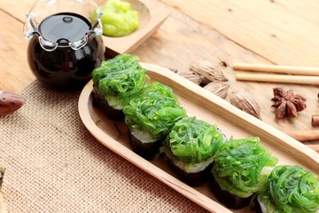 Sushi roll and seaweed salad is delicious.