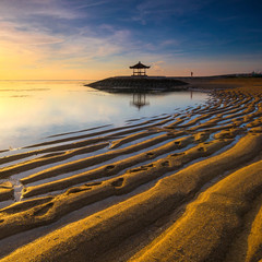 Karang Beach Sanur,Bali,Indonesia At Sunrise With Golden Sand Texture.Slightly Noise And Soft Focus.