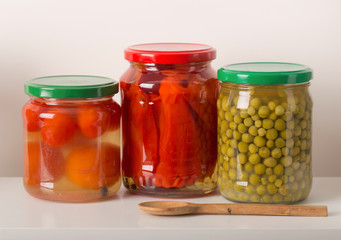 Fototapeta na wymiar Jars with pickled vegetables on white background