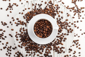 Coffee cup and beans on a white background.