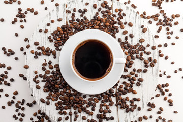 Coffee cup and beans on a white background.