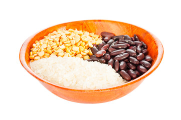 Collection of groats in bowl on white background