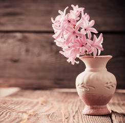 pink flowers on wooden background
