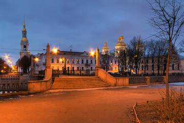 Obraz premium Krasnogvardeyskiy bridge and St. Nicholas Naval Cathedral illuminated at night, HDR, St. Petersburg, Russia.