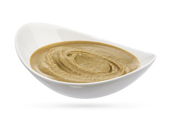 Ceramic bowl with mustard isolated on white background.