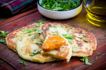 Potato flatbread with herbs, rustic vegetable dish, delicious