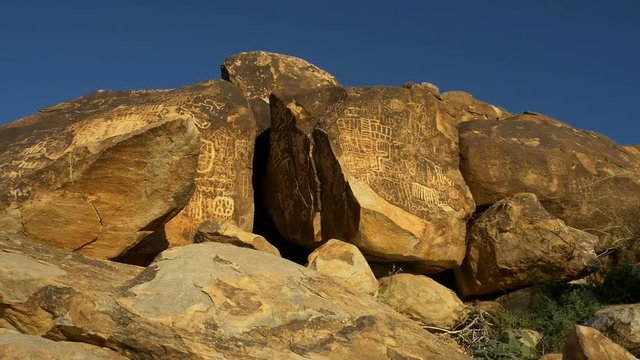 Petroglyphs high on a cliff in the desert