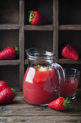 Sweet fresh strawberry juice on the vintage table