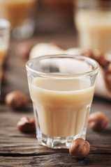 Italian traditional hazelnut liqueur on the wooden table