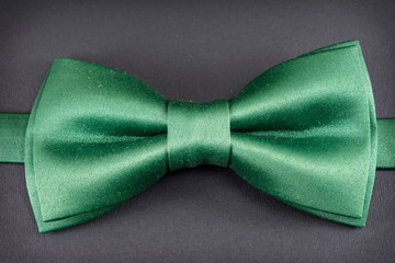 Green bow tie on black