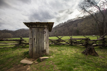Fototapeta na wymiar Wooden Outhouse. Wooden outhouse on display in the Great Smoky Mountains National Park.