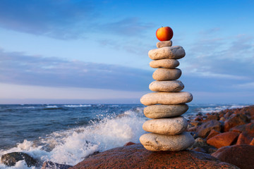 Concept of balance and harmony. Rock Zen at sunset.