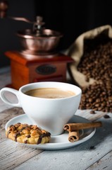 Coffee, roasted beans, mill grinder and some sweets