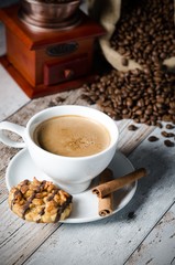 Coffee, roasted beans, mill grinder and some sweets