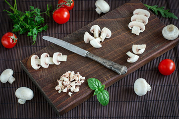 Fototapeta na wymiar Mushrooms Champignons And Tomato