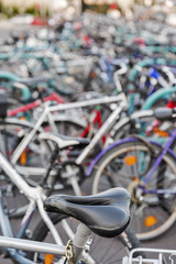 Fototapeta na wymiar Blurred bicycles parking outdoor background