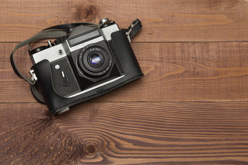 vintage camera on the wooden background