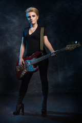 Fototapeta na wymiar Rock star playing bass guitar