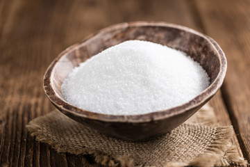 Old wooden table with white Sugar