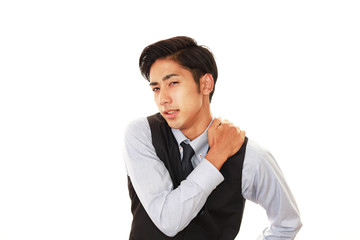 肩痛を訴えるビジネスマン