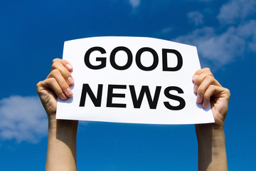good news, hands holding paper with text concept, positive media