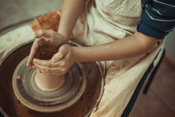 man working on a potter's wheel