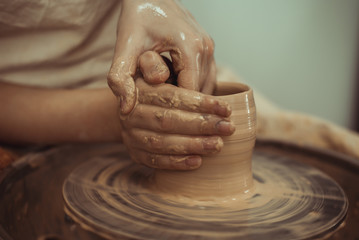 man working on a potter's wheel
