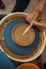 man working on a potter's wheel