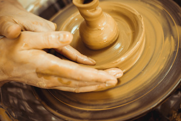 man working on a potter's wheel