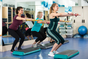 Women having group aerobic train .