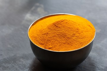 Fresh ground Turmeric powder close up view