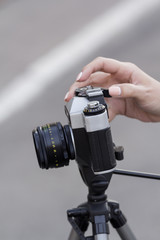 the girl in the hands of is holding the vintage camera