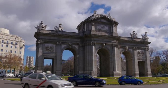 madrid traffic circle puerta de alcala sun light day 4k spain
