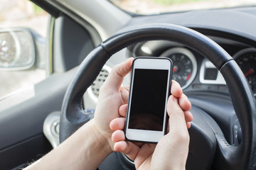 smartphone in the car, male hands holding mobile with empty screen