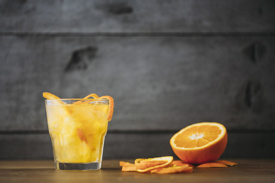 Orange juice with peel and sliced fruit