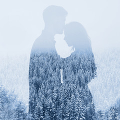 Fototapety  love in winter, silhouette of couple on forest background, double exposure