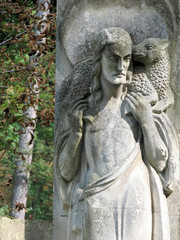 Fototapeta na wymiar stone sculpture of the Prophet carrying a lamb on his shoulders