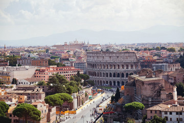 Fototapeta na wymiar Coliseum and panoramic view of Rome, Italy