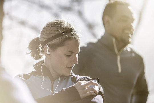 Close up of athlete using mp3 player